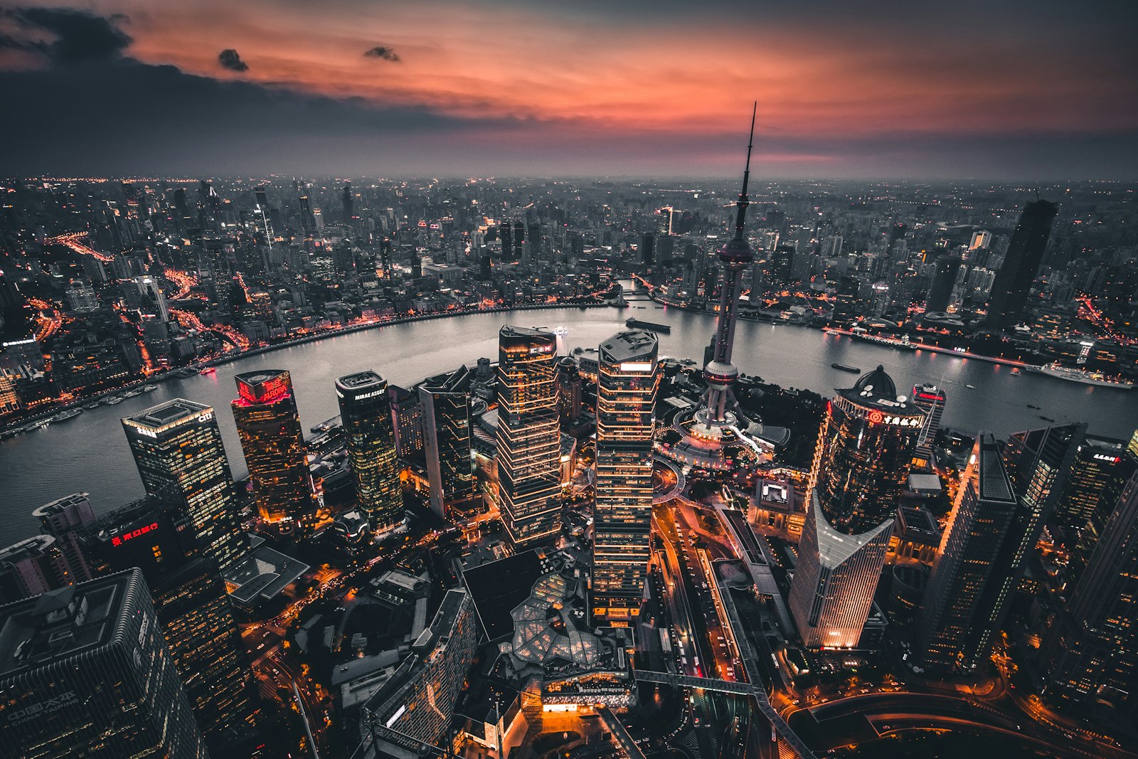Shanghai skyline with modern office towers across the river at dusk